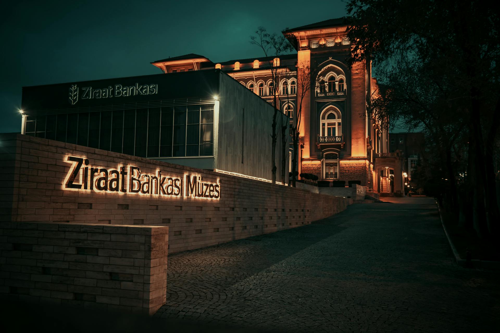 A stunning night view of the illuminated Ziraat Bank Museum in Ankara, Türkiye.