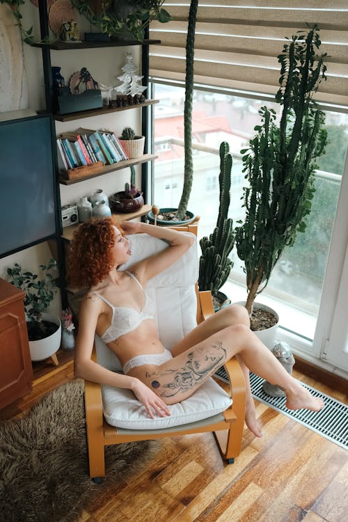 Woman Wearing Lingerie Posing on Chair 
