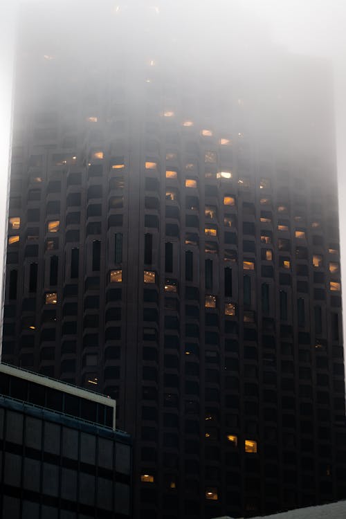 Facade of a Modern Skyscraper in Fog 