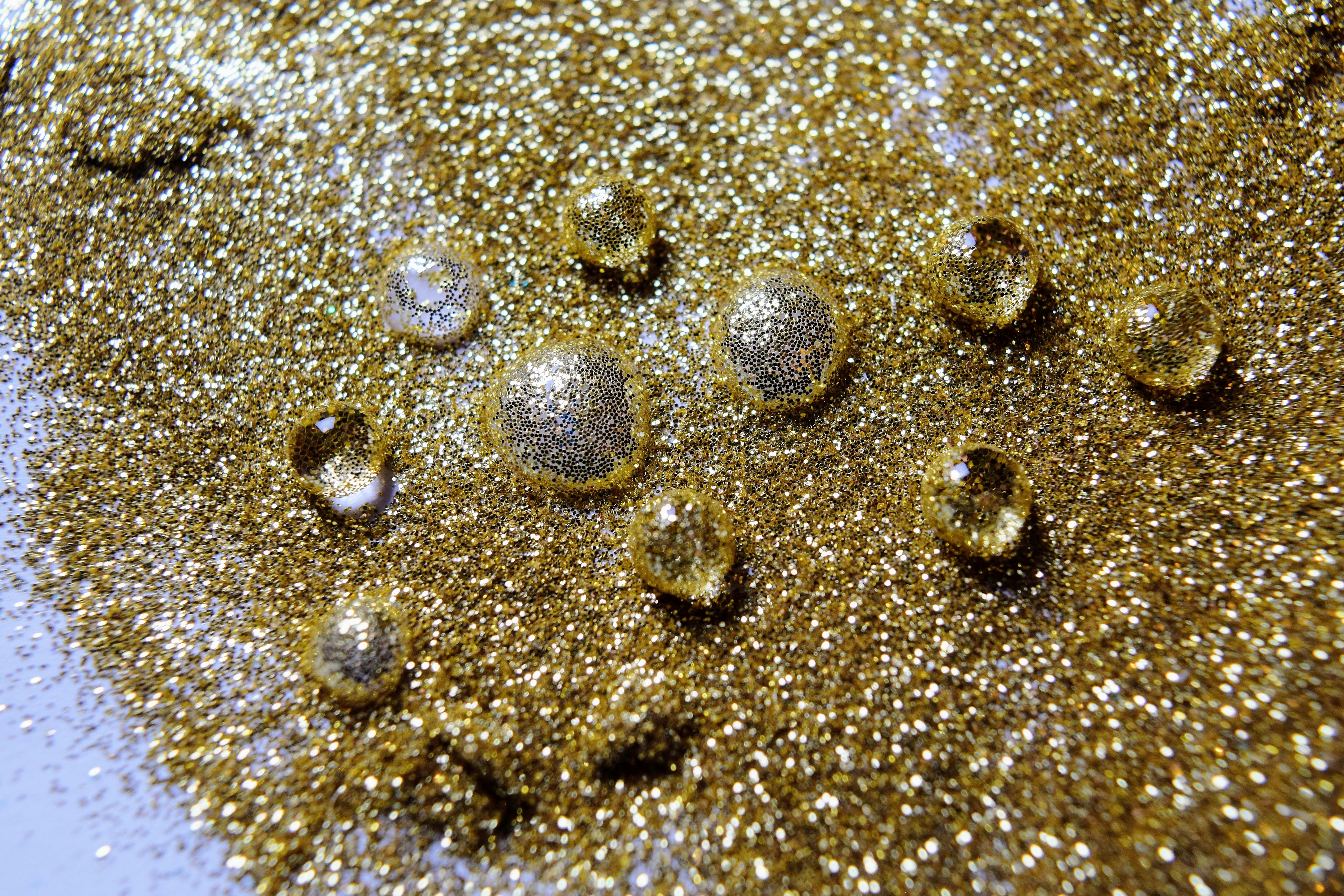 Free stock photo of close up glitter, glitter, gold glitter
