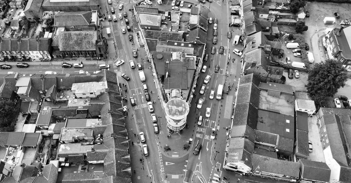 Aerial black and white photo of Luton city center showing busy streets and buildings.