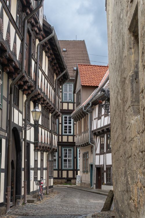 Free Charming narrow street of timber-framed houses in Quedlinburg's medieval old town. Stock Photo