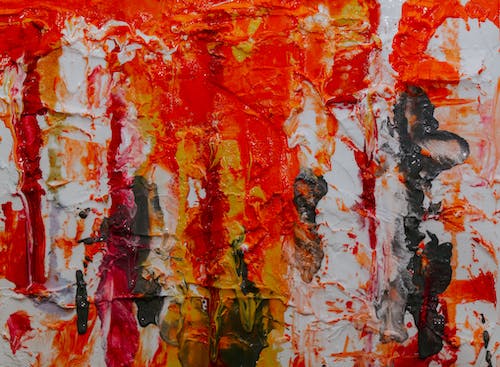 Lukisan Abstrak Merah, Kuning, Dan Hitam Di Atas Kanvas Putih