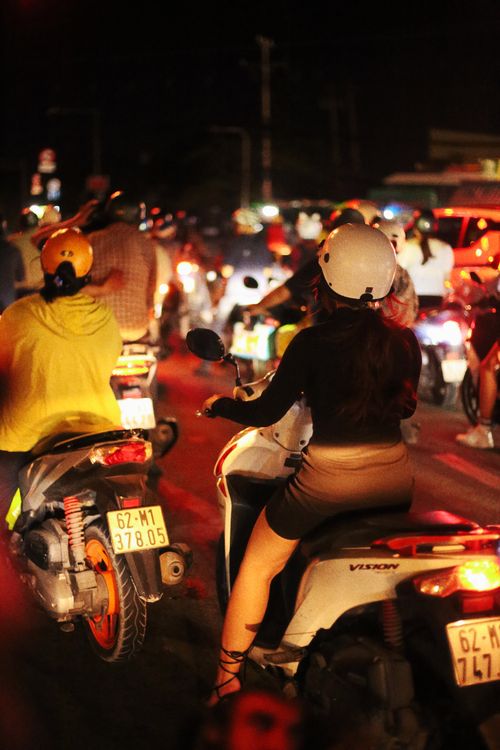 Free Nighttime urban motorcycle traffic jam with diverse riders in helmets. Stock Photo