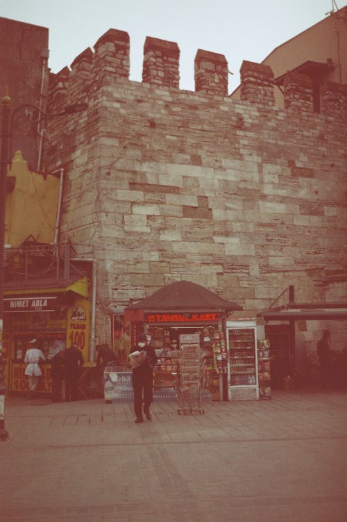 Castle Wall over Newsagents in Old Town in Turkey