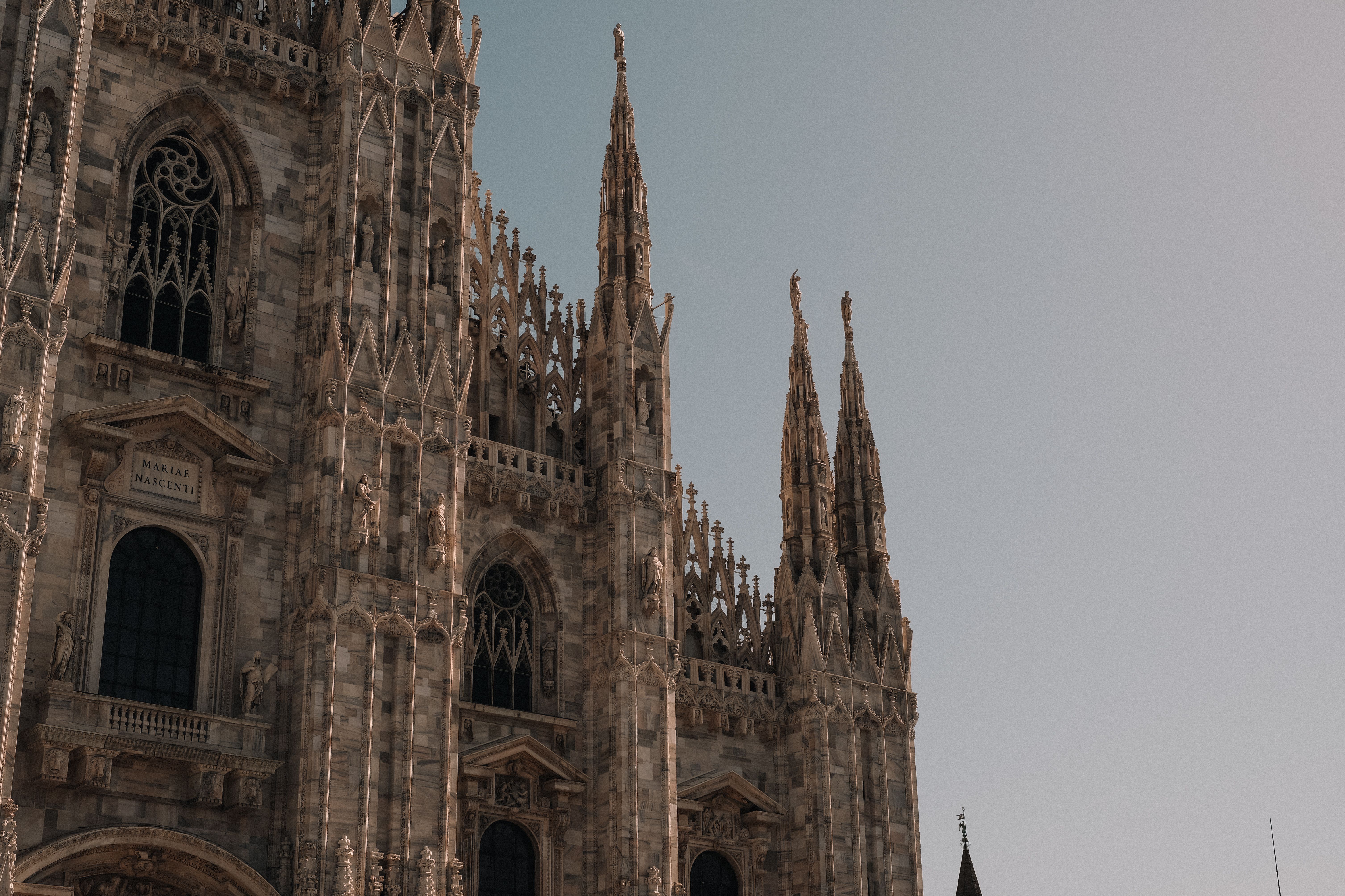 Stunning view of the Gothic architecture of Milan Cathedral in the daylight.