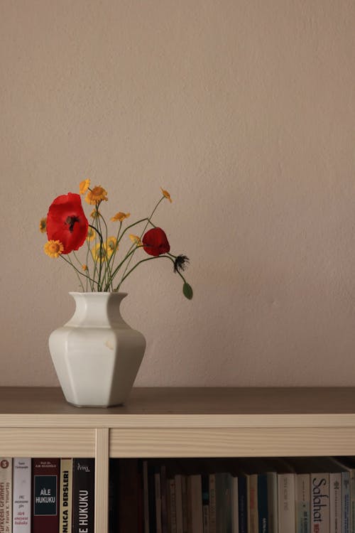 Vase with Flowers on Bookcase