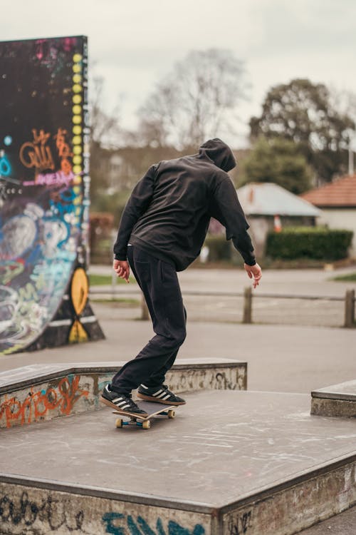 Man Skateboarding in Skatepark