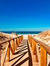 Empty Brown Wooden Dock Towards Beach