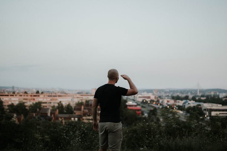 Man Looking Towards The City