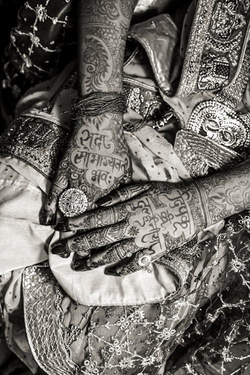 Close-up of Hands of a Bride Covered in Henna Tattoos 