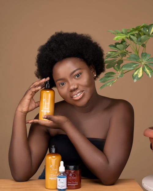 Portrait of an African Woman Holding Cosmetics 