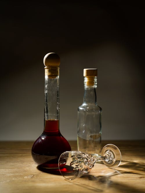 Close-up of Vintage Liquor Bottles and a Crystal Glass