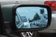 Car Side Mirror Showing Heavy Traffic