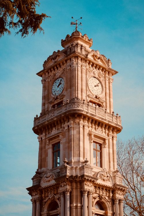 Free Ornate Neo-Baroque clock tower at Dolmabahçe Palace, Istanbul during daytime. Stock Photo