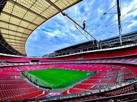 A stunning view of the iconic Wembley Stadium in London, capturing its vastness and architectural beauty.
