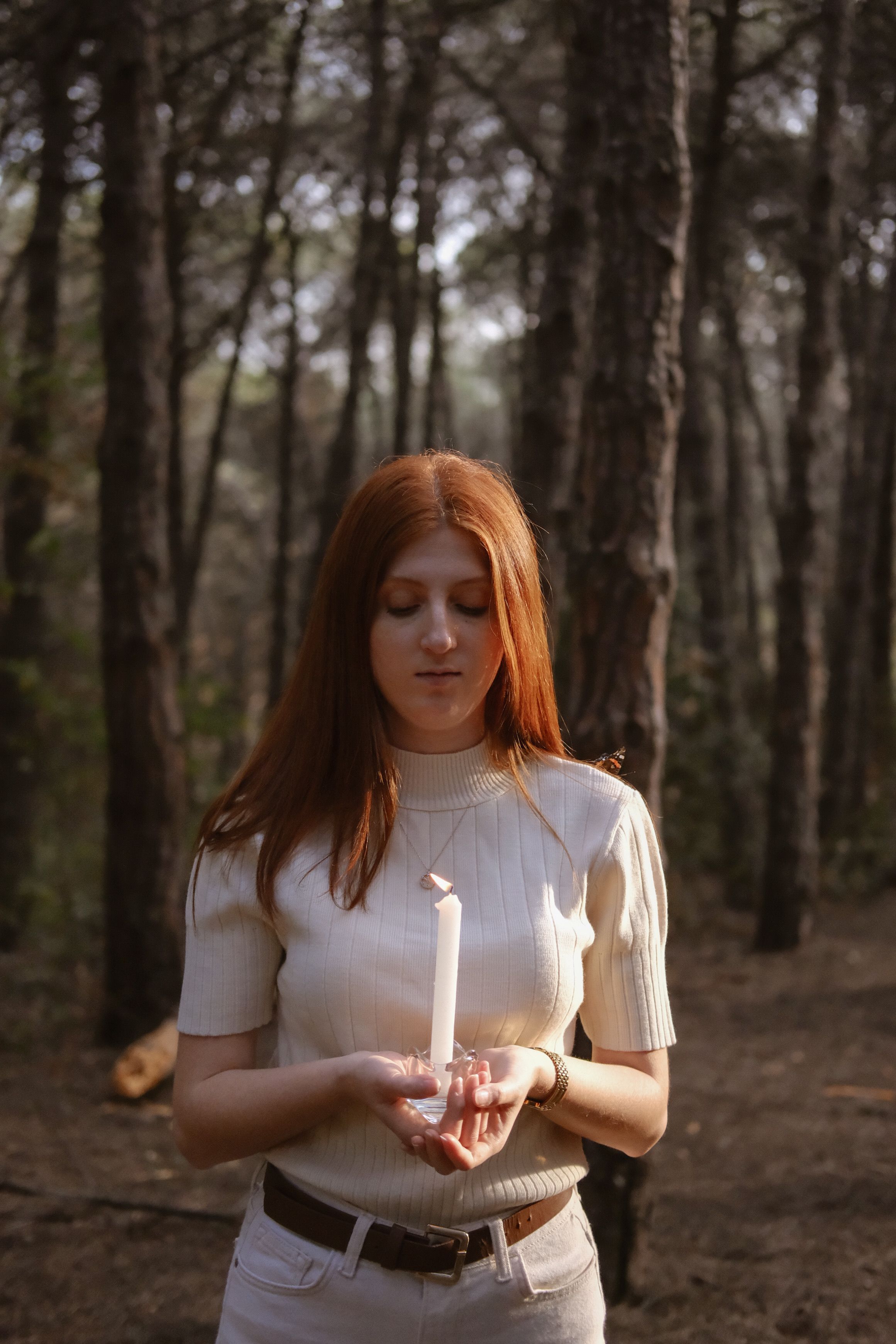 Young Woman with a Butterfly on Her Shoulder Standing in the Forest ...