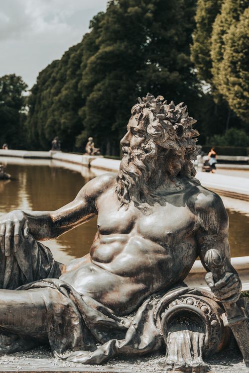 Free Majestic bronze sculpture near the fountain at Palace of Versailles, France. Stock Photo