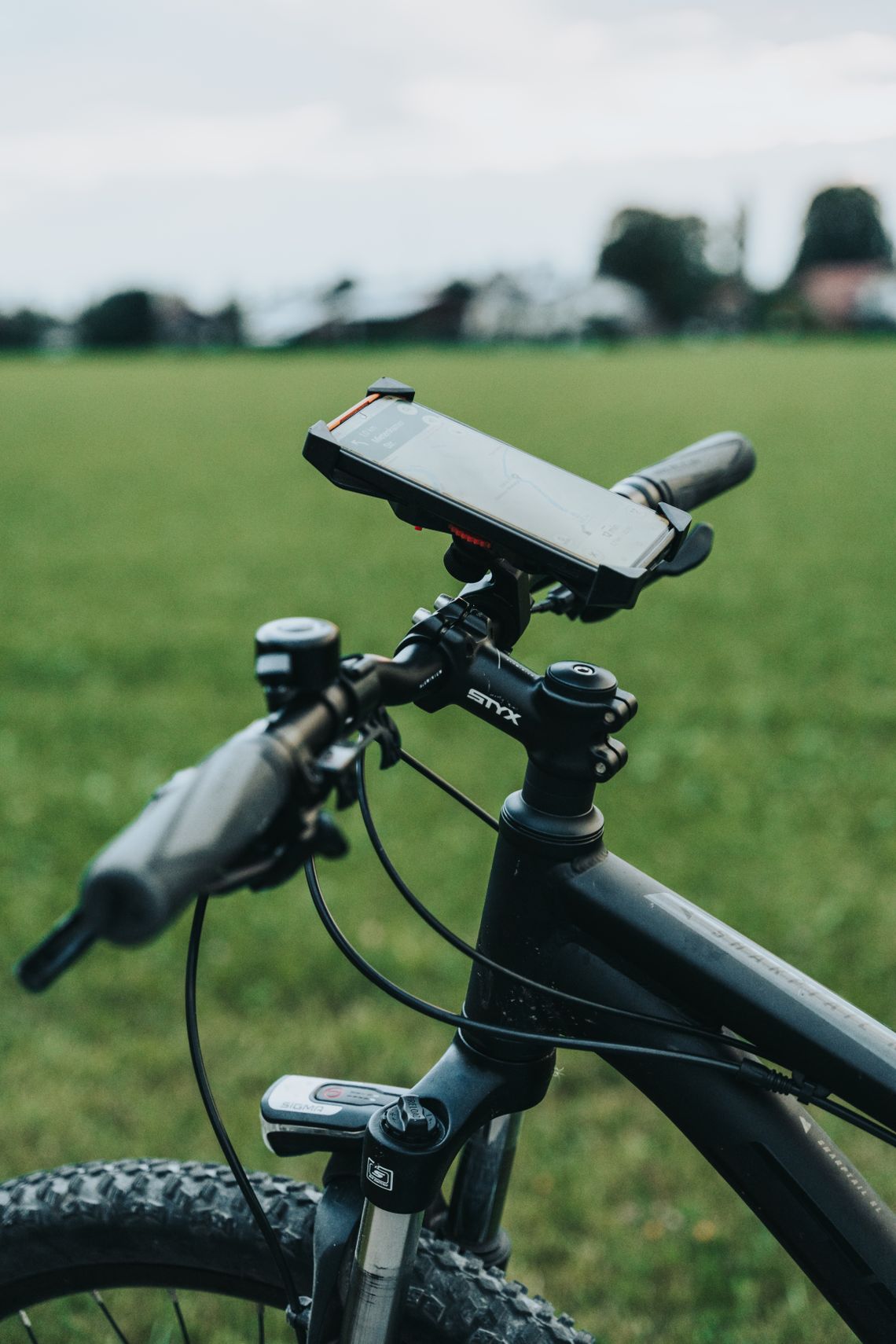 Close-up of a bicycle handlebar fitted with a smartphone mount