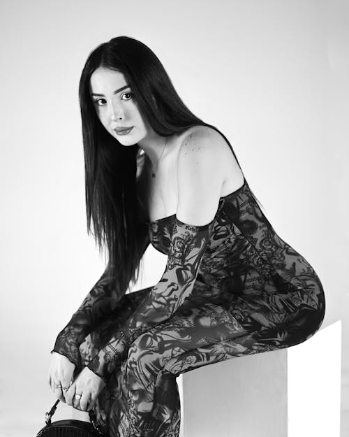 Black and White Studio Shot of a Young Woman in a Dress 