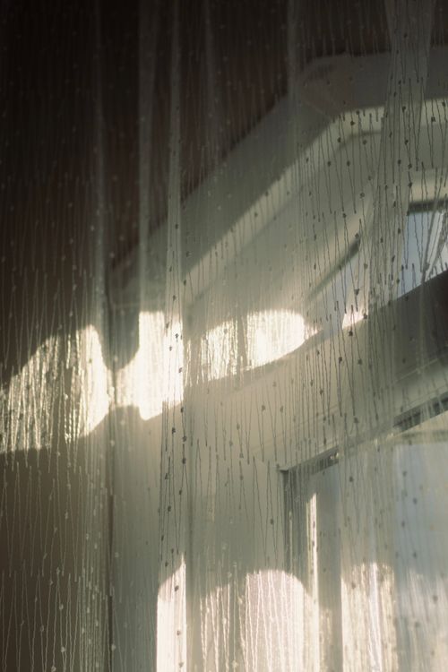 Free Elegant sunlight filtering through white beaded curtains in Istanbul. Stock Photo