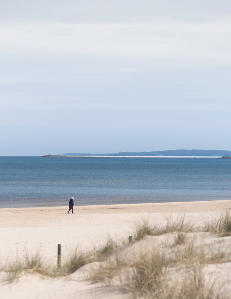 Person Walking Sandy Beach