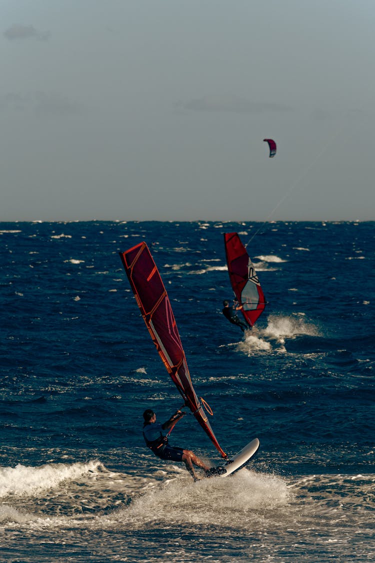 Windsurfers On Sea