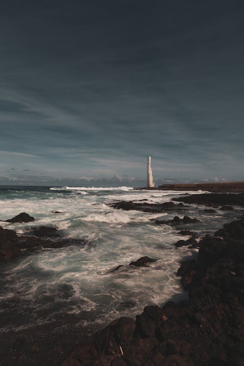 Foto profissional grátis de áspero, beira-mar, espuma