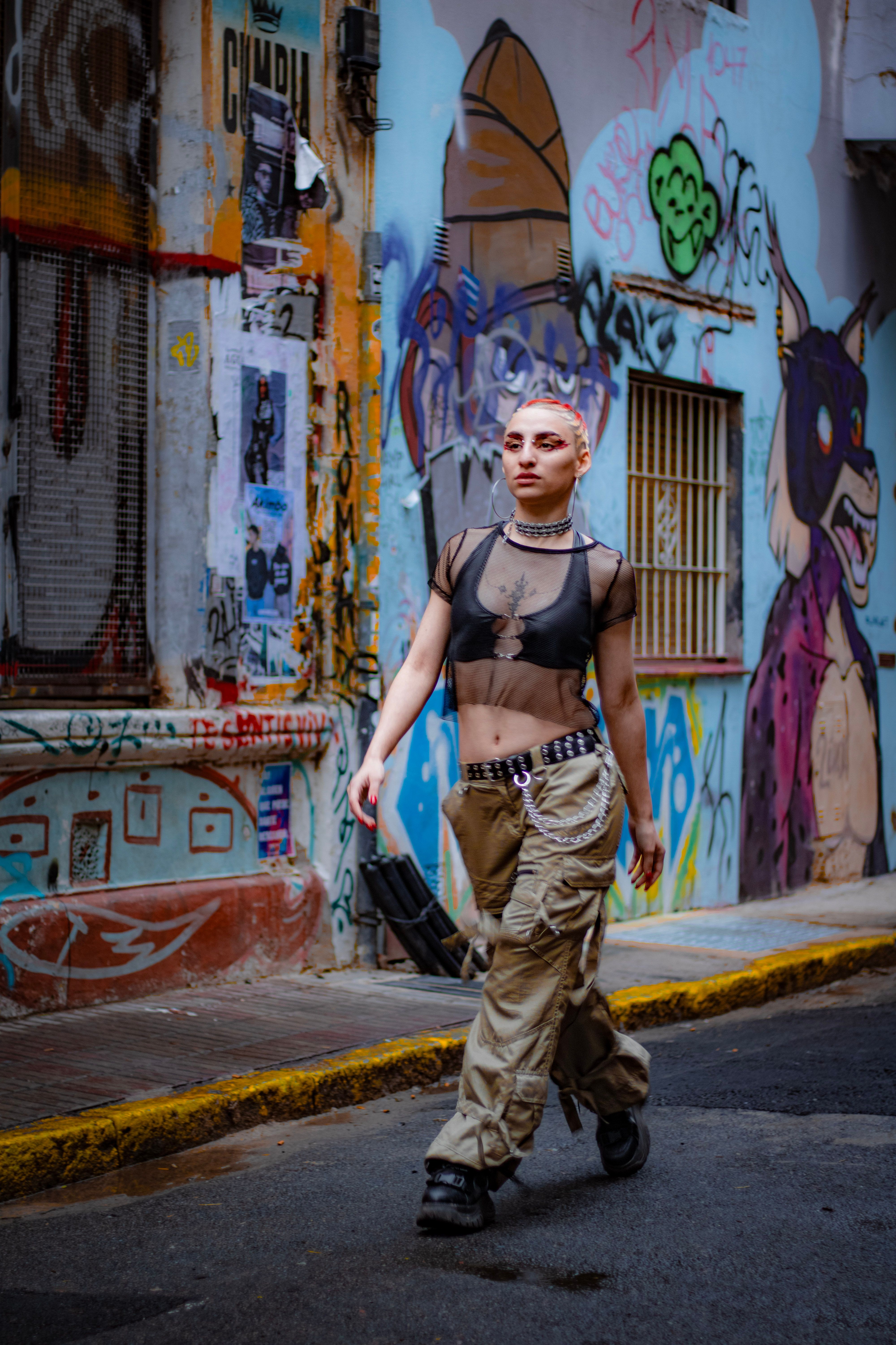 Woman walking in city wearing cargo pants