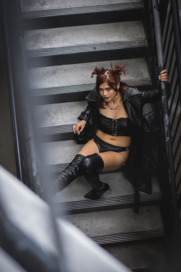 Woman In Leather Black Lingerie On Steps