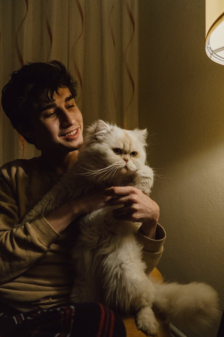 Smiling Man With White Persian Cat