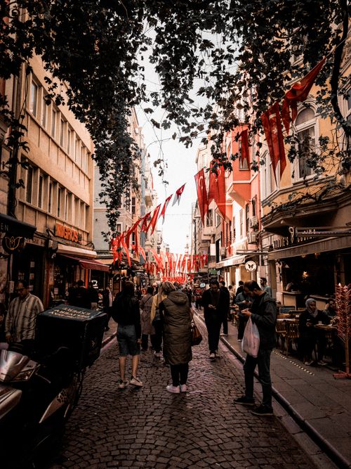 Free Captivating view of a bustling street in Beyoğlu, Istanbul adorned with Turkish flags, showcasing rich culture and life. Stock Photo