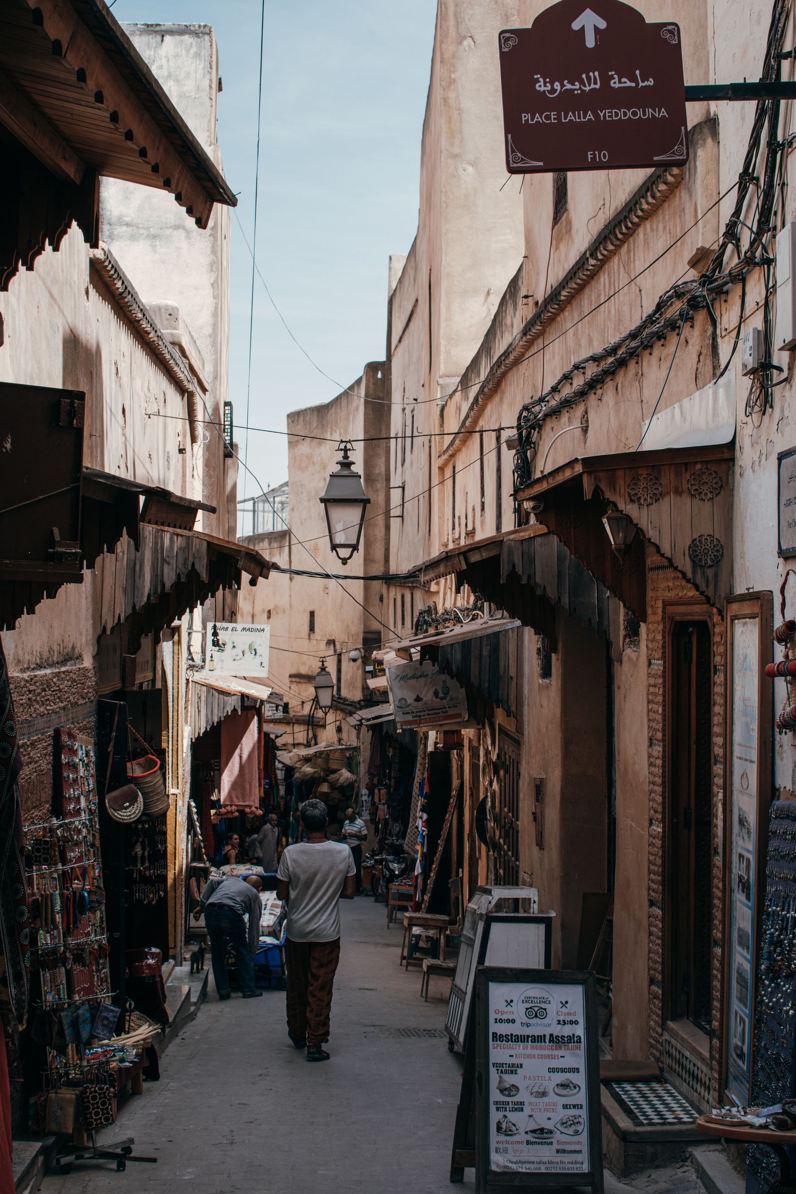 Narrow alley of Fès el-Bali lined with shops