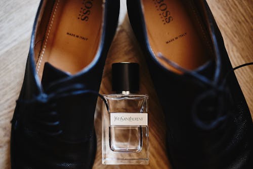 Luxury Perfume and Shoes on a Parquet 
