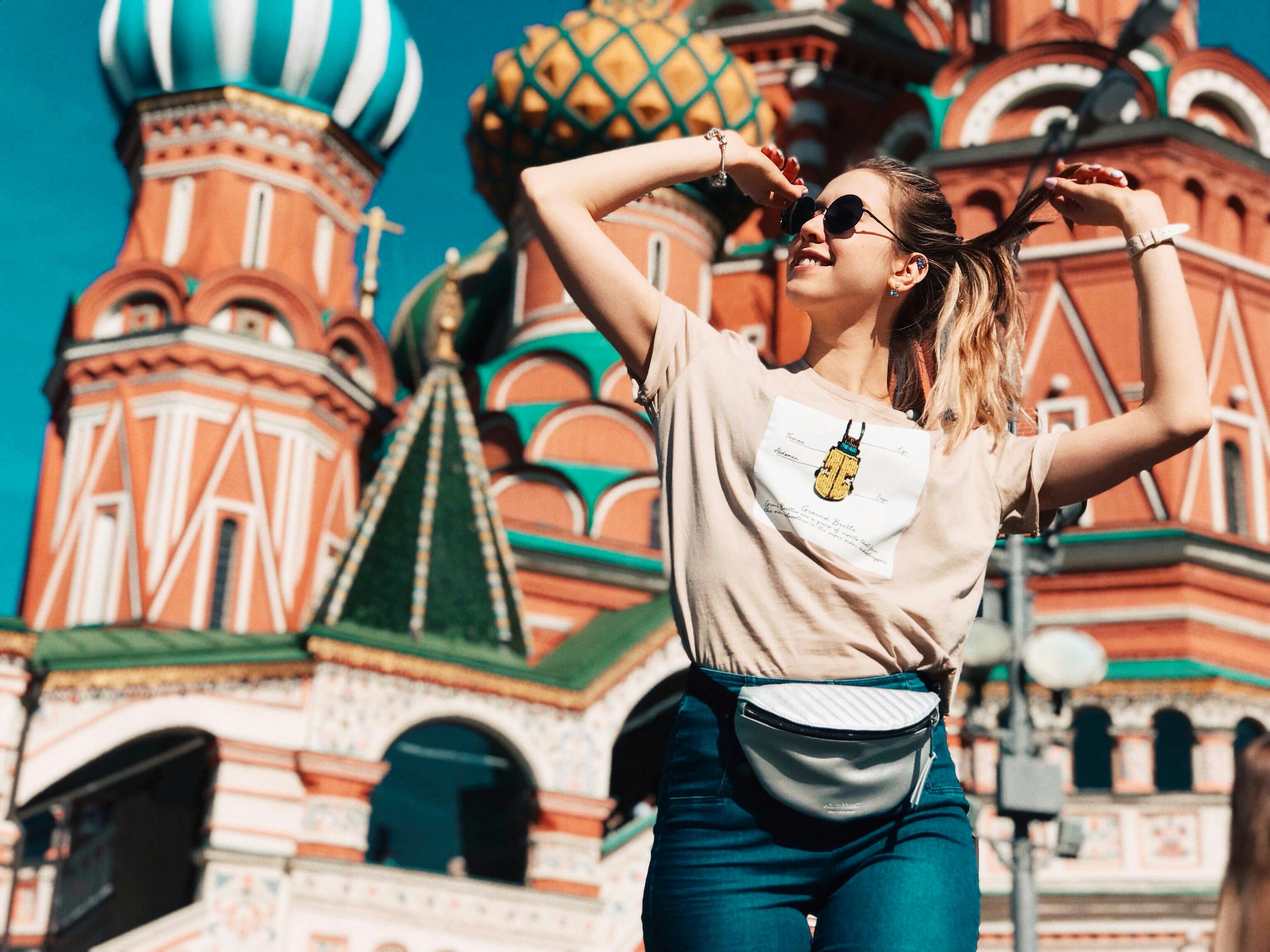 Photo of Woman Dancing With Saint Basil's Cathedral in Moscow, Russia in the Background