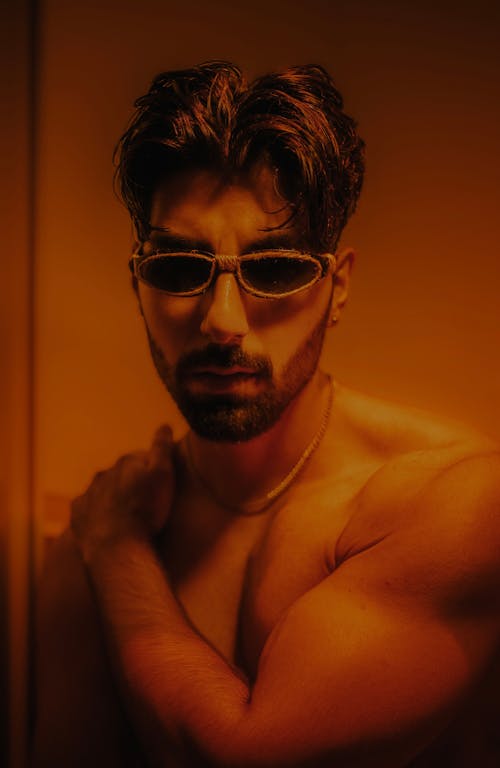 Portrait of a Shirtless Model Wearing Sunglasses