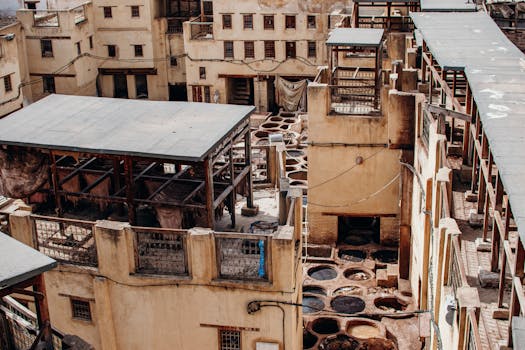 Aerial view of Chouara Tannery in the old town of Fes, Morocco showcasing traditional tanning pits.