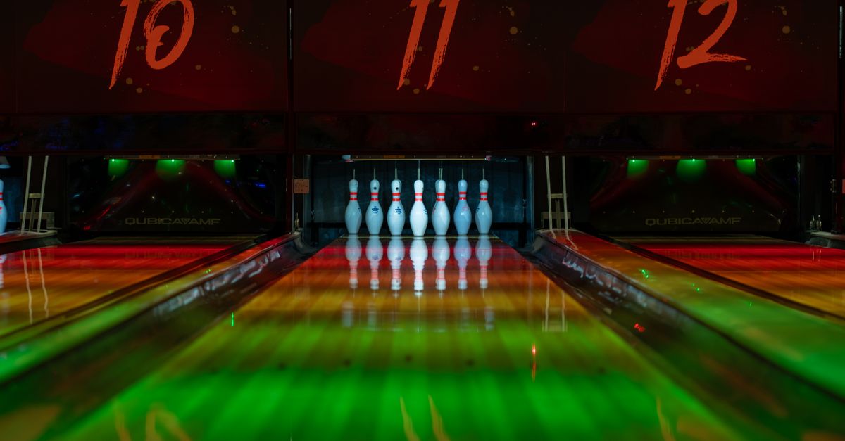 Vibrant bowling alley featuring colorful lanes and pins ready for the next game.