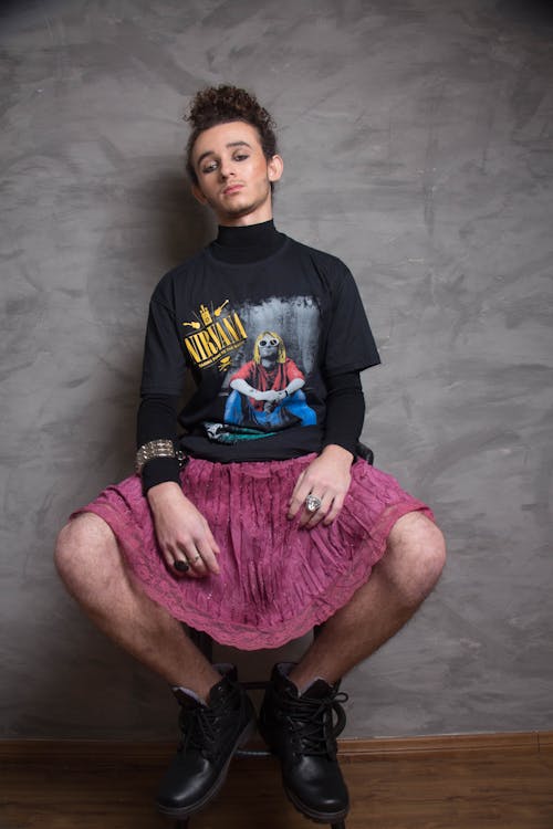 Male Model Wearing a Black Shirt and a Pink Skirt
