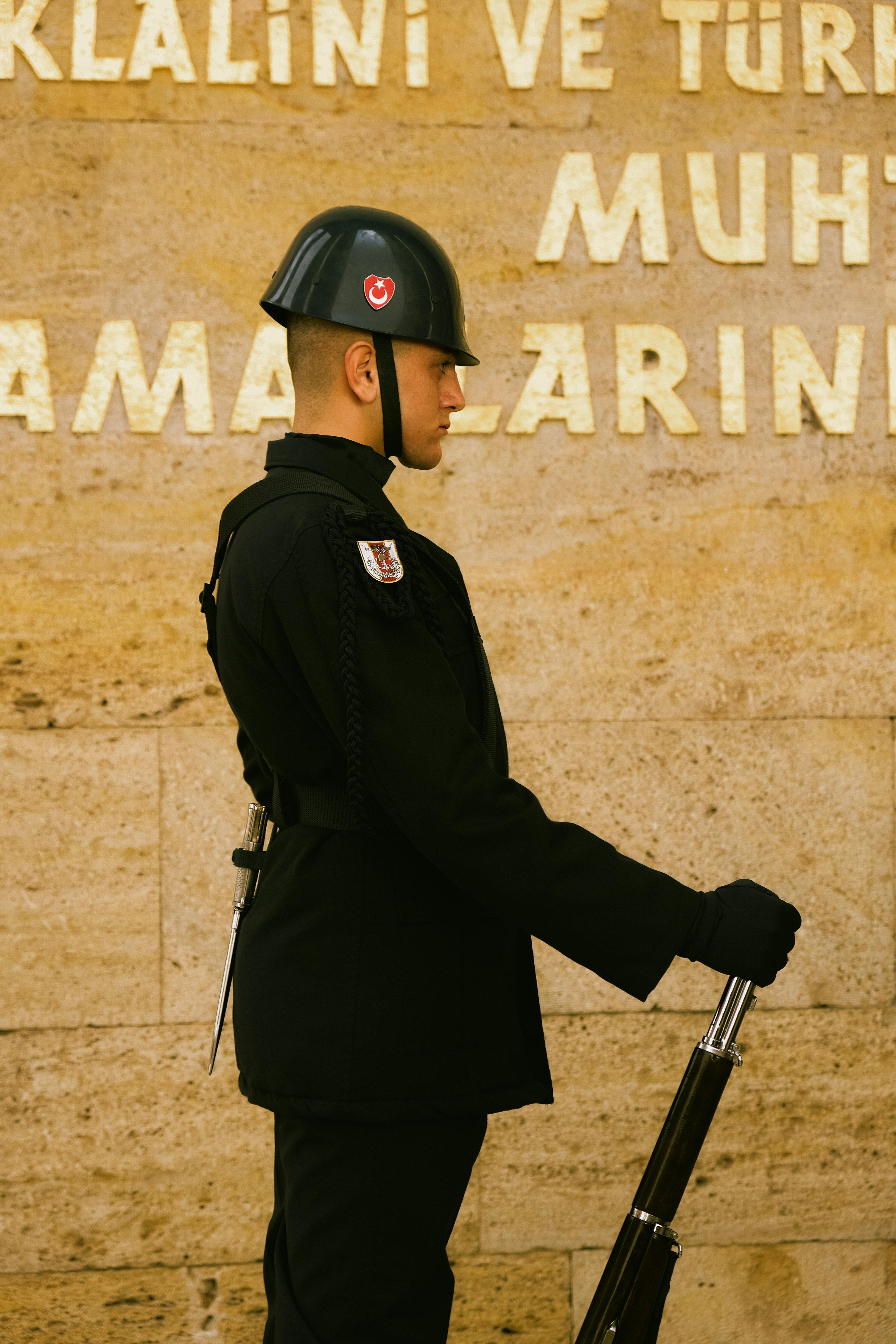 Side view of a soldier standing guard with a rifle at Anıtkabir, Ankara, Turkey.