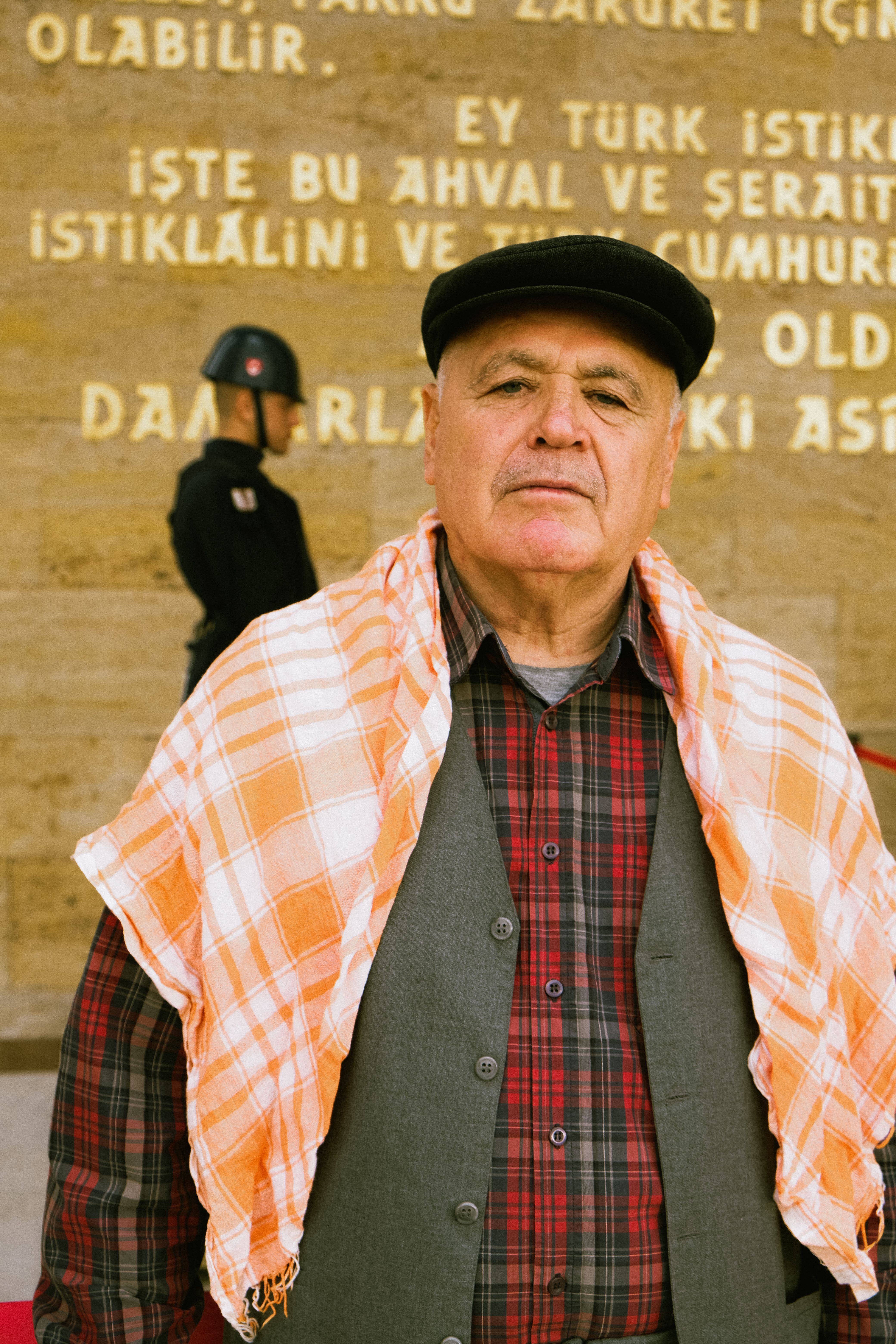Elderly man standing in front of Anıtkabir monument in Ankara, Turkey.