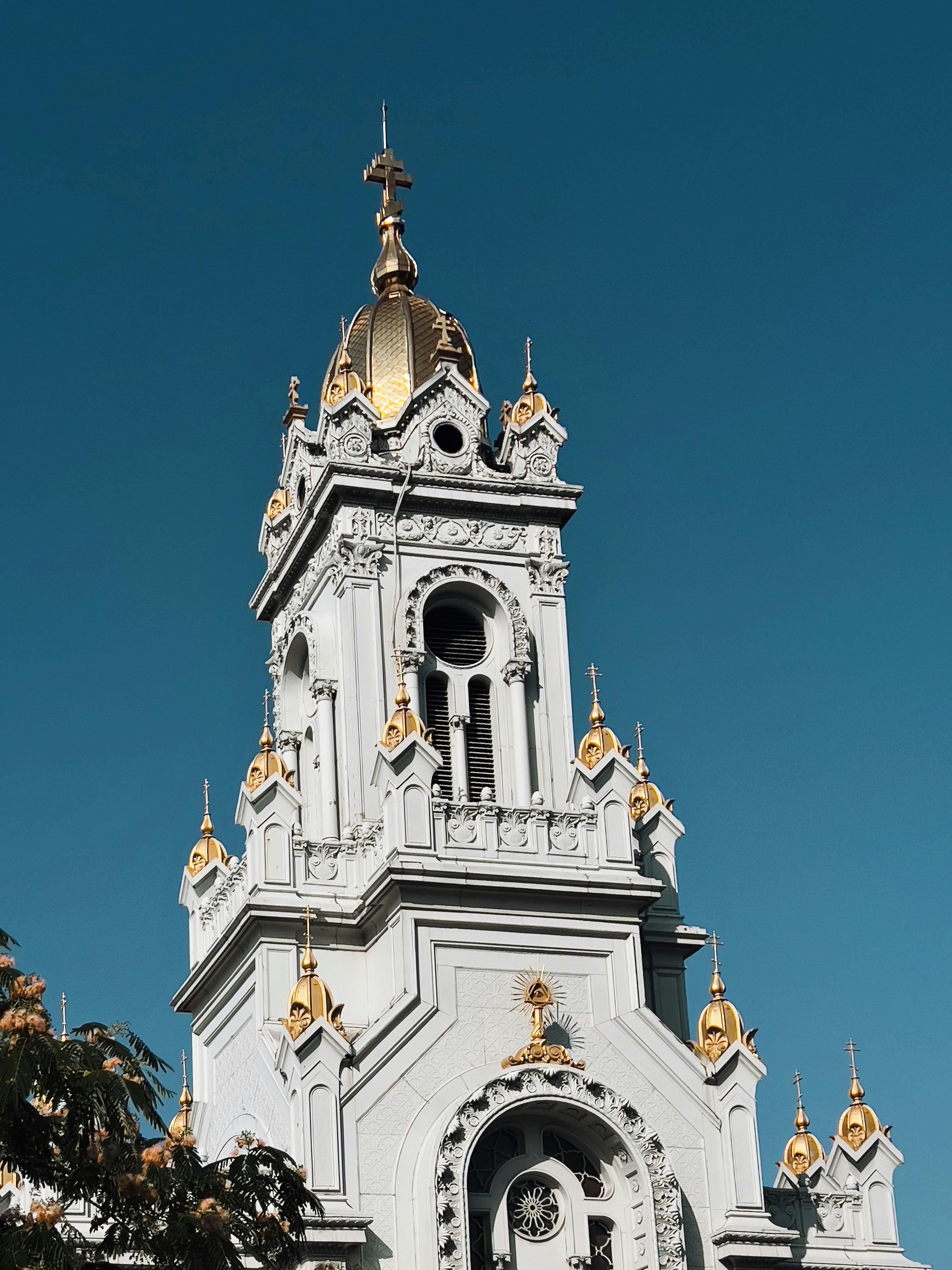 The ornate tower of St. Stephen's Church in Istanbul showcased with a clear blue sky backdrop.