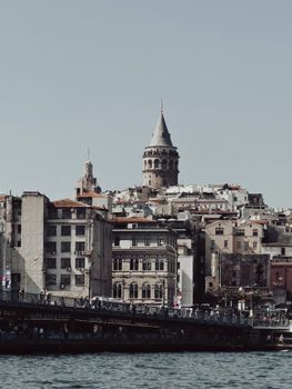 Stunning view of Galata Tower amidst Istanbul's urban landscape, showcasing Turkey's rich architecture.