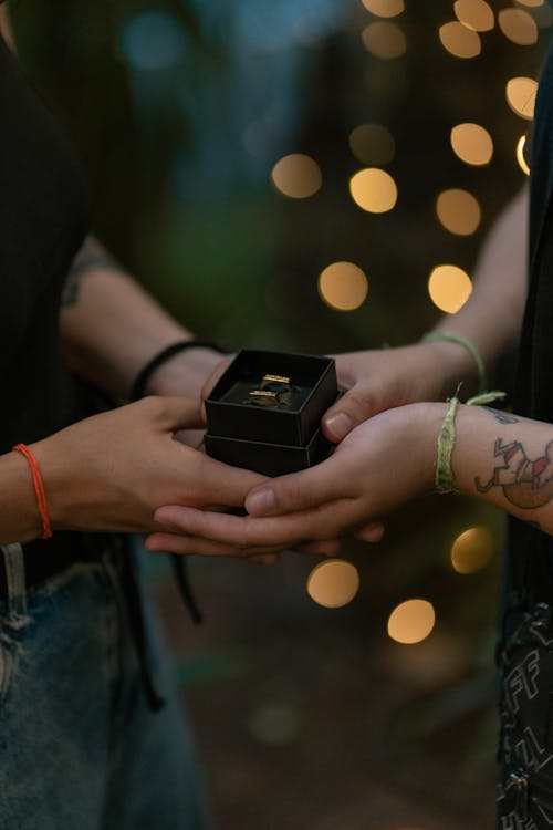 Hands Holding Box with Rings