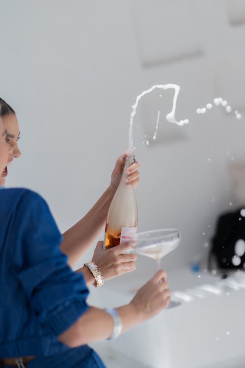 Women Splashing Champagne during a Celebration 