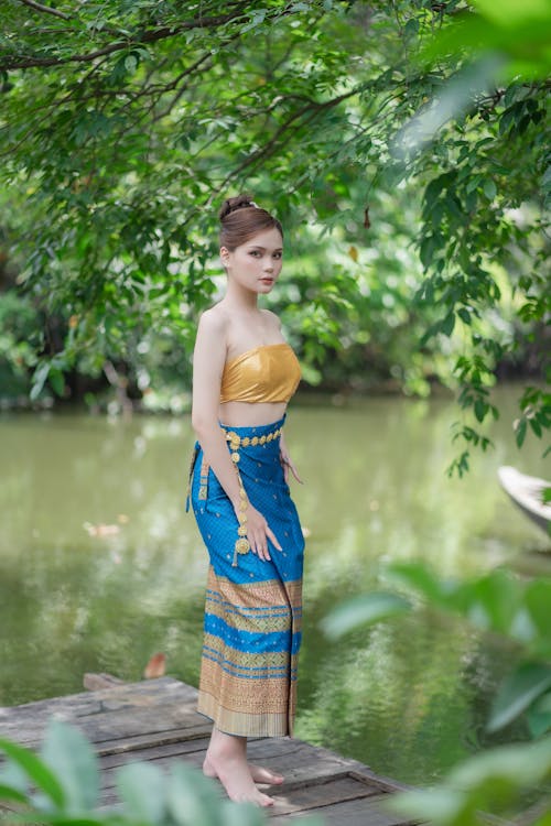 Woman in Skirt Standing by River