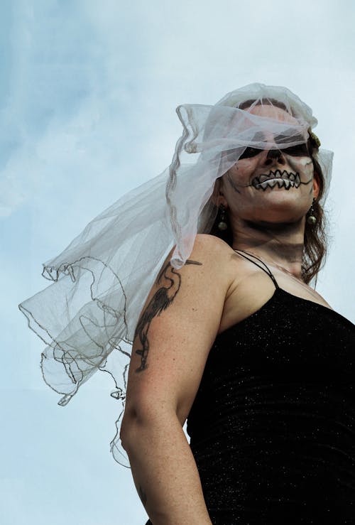 Woman in Veil and with Painted Face for Halloween