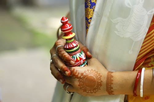 Woman Hands with Henna Tattoos