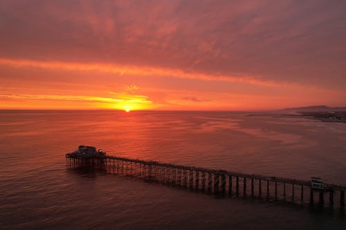 Pier on Sea Shore at Sunset