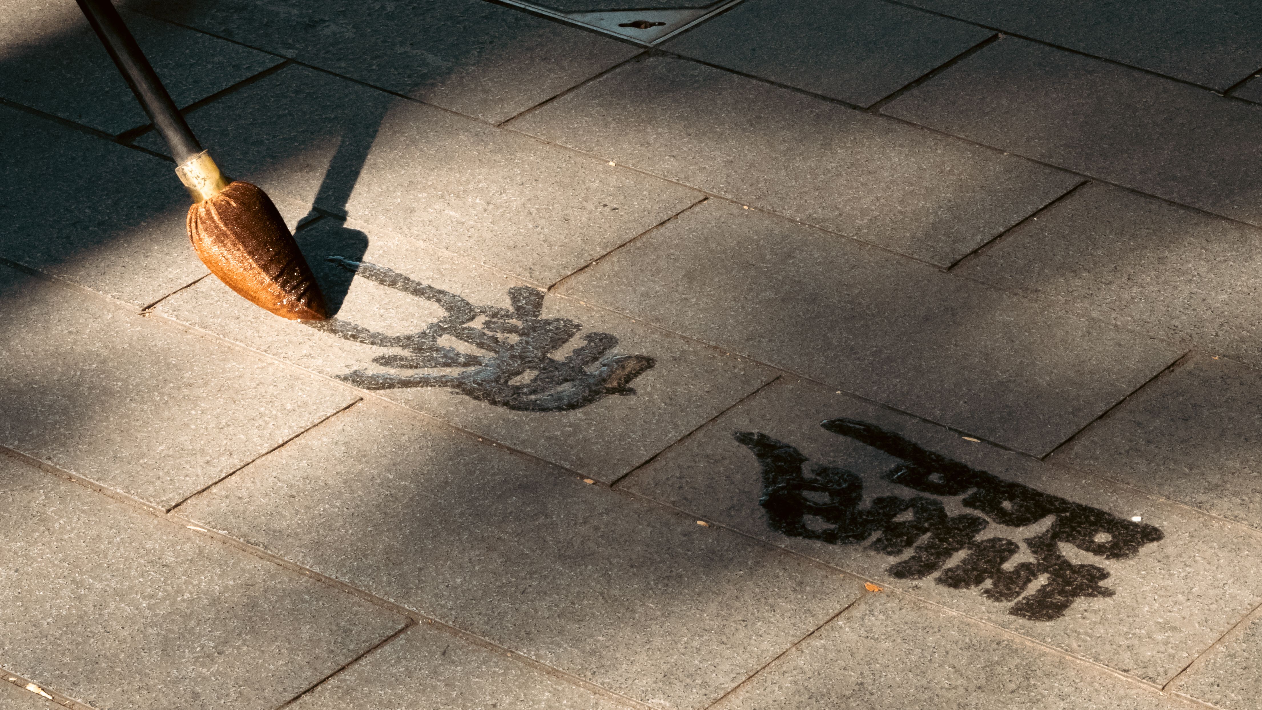 Painting Writing on Pavement · Free Stock Photo